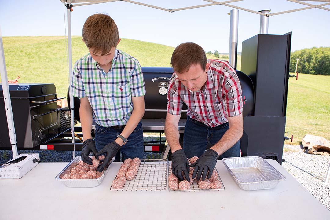 https://www.meadowcreekbbq.com/wp-content/uploads/2022/07/52_Loading_Sausage_Balls.jpg